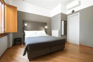 Postel nebo postele na pokoji v ubytování Piazza Carità
