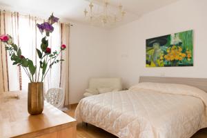 Postel nebo postele na pokoji v ubytování Guest House Le Acacie