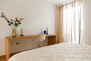 Postel nebo postele na pokoji v ubytování Guest House Le Acacie