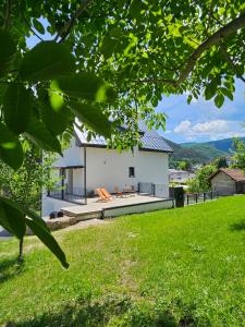 a view of the house from the yard at Apartments NIM in Jajce