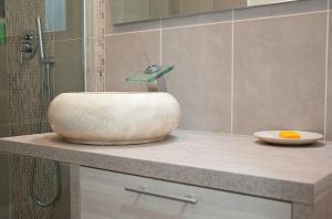 a bathroom with a sink and a shower at Next to Disney Appart' Le Rêve Bleu in Torcy +21 photos