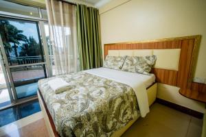 Postel nebo postele na pokoji v ubytování Vert Garden Hotel