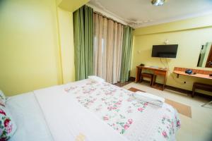TV a/nebo společenská místnost v ubytování Vert Garden Hotel