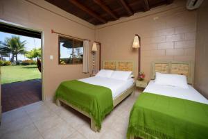 Ένα ή περισσότερα κρεβάτια σε δωμάτιο στο Hotel Kundalini