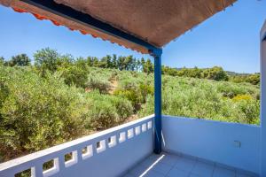 a view from the balcony of a house at Hillside Hideaway in Paliouri