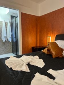 Giường trong phòng chung tại Gammazita Luxury Home