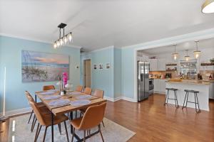 a dining room and kitchen with a table and chairs at Fort Freedom in Beaufort