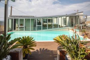 a house with a swimming pool in front of it at AG Villa Razo Luxury en primera linea con piscina in Razo