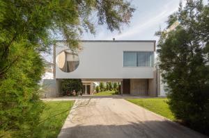 a large white house with a driveway at AG Villa Razo Luxury en primera linea con piscina in Razo +22 photos