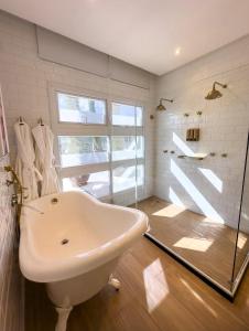 Um banheiro em Vila Pugliesi Hotel Boutique
