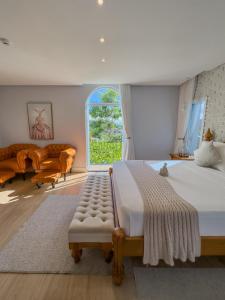 Cama ou camas em um quarto em Vila Pugliesi Hotel Boutique