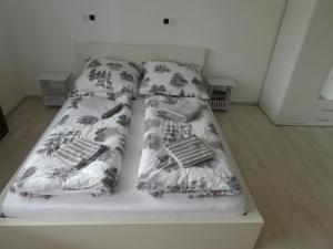 a bed in a room with two laptops on it at FeWo Ruhe in Olsberg +41 photos