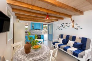 a living room with a table and a couch at Vila Mare in Risika