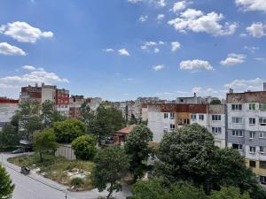 a view of a city with buildings and trees at Balik Sky Residence Apartment in Dobrich