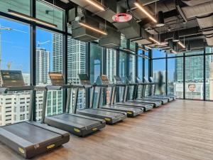 a gym with a row of beds in a room with windows at MVR Miami s Top Stay Views for Days in Miami