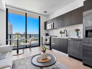 a kitchen and living room with a large window at MVR Miami s Top Stay Views for Days in Miami