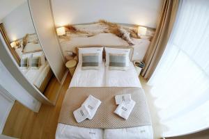 Postel nebo postele na pokoji v ubytování Apartments AQUA & SPA