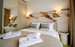 Postel nebo postele na pokoji v ubytování Apartments AQUA & SPA