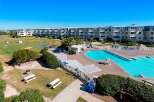 an aerial view of an apartment complex with a swimming pool at ABPAB89 A Place at the Beach 355 in Atlantic Beach