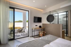 Ένα ή περισσότερα κρεβάτια σε δωμάτιο στο Theros Hani Blue +22 φωτογραφίες