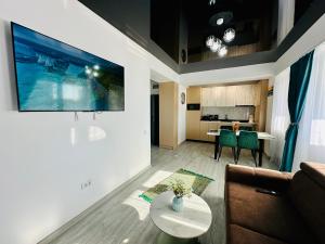 a living room with a couch and a table at MiMar Apartment in Năvodari