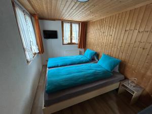 Rúm í herbergi á Alpenchalet Spiher-Studio und ein weiteres Schlafzimmer