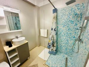 a bathroom with a shower and a sink at MiMar Apartment in Năvodari +25 photos
