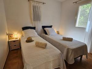 En eller flere senge i et værelse på Casa Parmentile