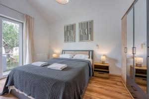 Posteľ alebo postele v izbe v ubytovaní Villa Kontesici 12 + 24 fotografií