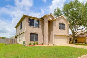 a house with a grass yard in front of it at 7 Mi to Downtown Baytown Spacious Home with Yard in Baytown