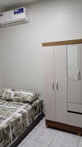 Ένα ή περισσότερα κρεβάτια σε δωμάτιο στο Apartamento Completo e Centralizado 4