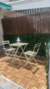 a table and two chairs on a patio at Bungalow en Santa Pola in Santa Pola