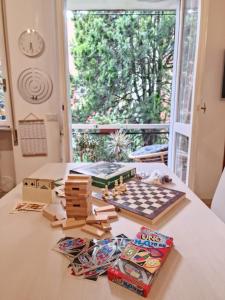 a table with a chess board and games on it at Casa Orso in Abbadia Lariana +41 photos