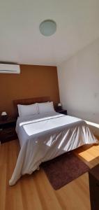 En eller flere senge i et værelse på EXCELENTE Apto