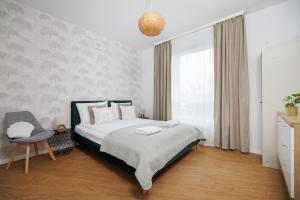Postel nebo postele na pokoji v ubytování INA Rent - Śląska 12 + 96 fotografií