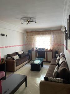 Posezení v ubytování Grand Appartement Martil