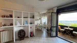 a room with a glass door and a room with a table at Jazz Loft in Perugia
