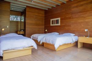 Elegant 5BR with Garden view Home in Cieneguilla客房内的一张或多张床位