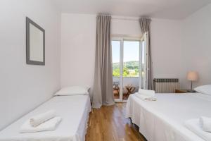 Posteľ alebo postele v izbe v ubytovaní Francesca Guesthouse