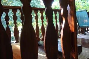 a view of a wooden railing on a porch at Brisas del Caribe 3 in Tapantí