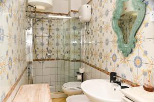 a bathroom with a toilet and a sink at Fantasy House Apartaments in Forio d'Ischia +57 photos