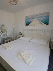 Posteľ alebo postele v izbe v ubytovaní Apartment ANTONELLA