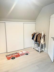 a room with wardrobes and a rug on the floor at Super family home - central location! in Oslo