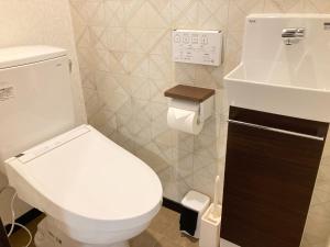 a bathroom with a white toilet and a sink at SA Inn Ina Nice Road - Vacation STAY 31748v in Ina