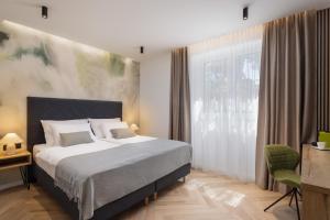 Postel nebo postele na pokoji v ubytování Grand Pearl Luxury Retreat