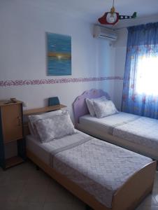 Postel nebo postele na pokoji v ubytování Grand Appartement Martil