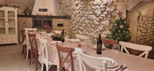 a dining room with a table and a christmas tree at RIOJA VALLEY Apartamentos Turísticos in Cenicero