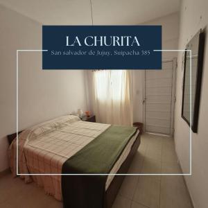 ein Bild eines Schlafzimmers mit einem Bett in einem Zimmer in der Unterkunft La Churita in San Salvador de Jujuy