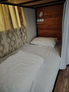Ένα ή περισσότερα κρεβάτια σε δωμάτιο στο Palm Guesthouse