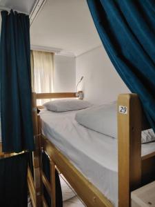 Ένα ή περισσότερα κρεβάτια σε δωμάτιο στο Palm Guesthouse